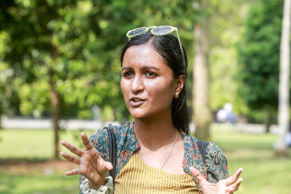 KL Reads founder, who only wanted to be known as Navina, said the movement has been attracting a steady stream of readers since relocating to the Perdana Botanical Gardens. — Picture by Sayuti Zainudin 